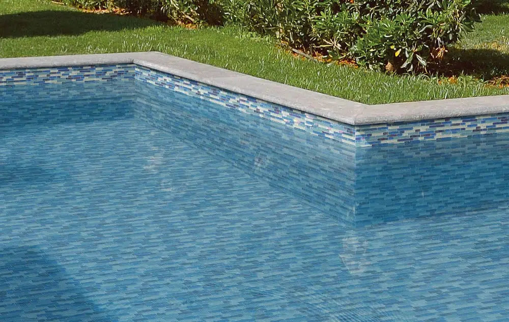 Mixed blue glass brick pool tile waterline